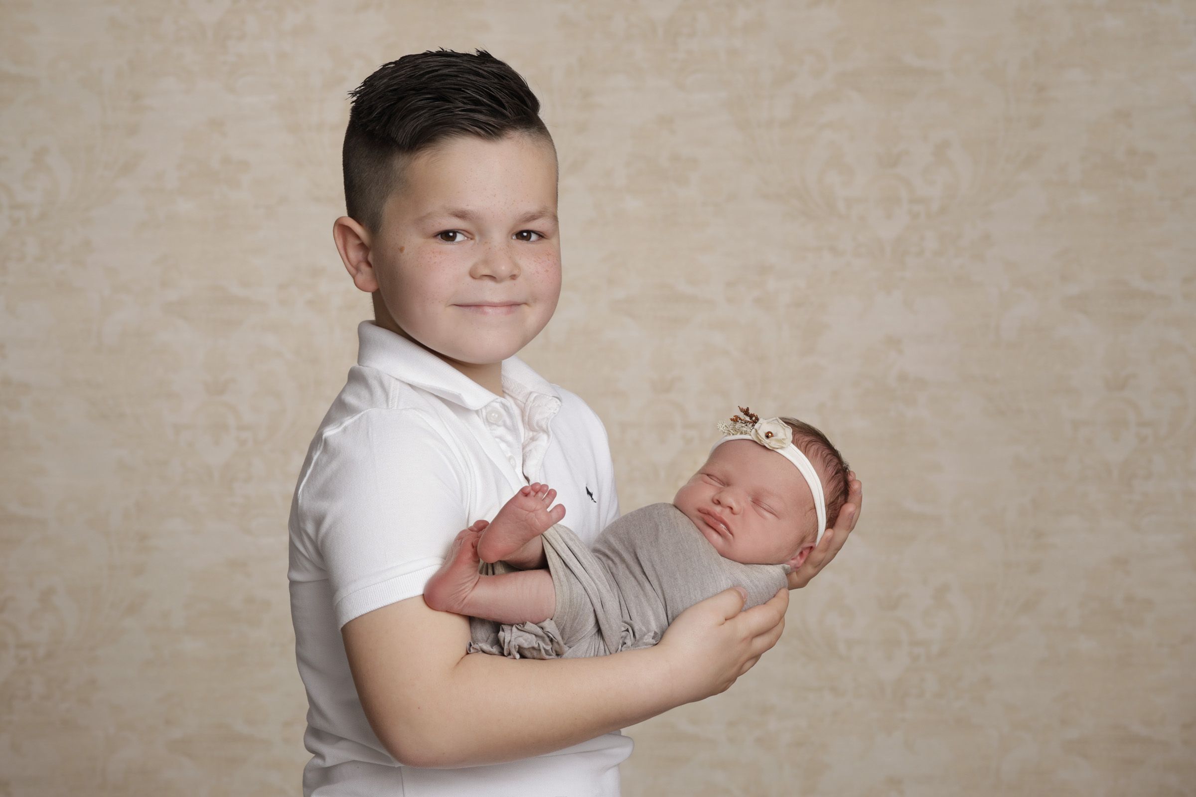 Bruder mit Geschwisterkind Fotos